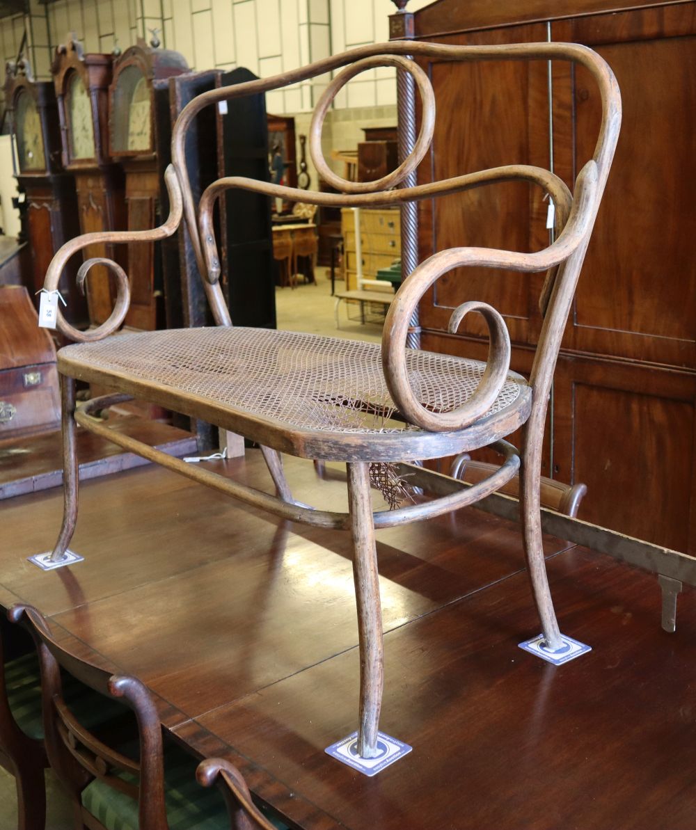 An early 20th century Thonet style caned bentwood settee (a.f), W.110cm, D.50cm, H.107cm